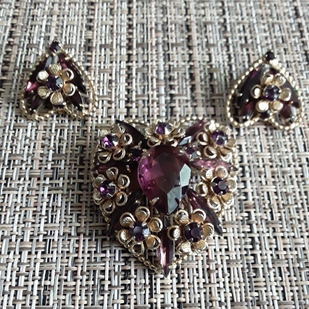 Purple heart brooch with matching earrings.